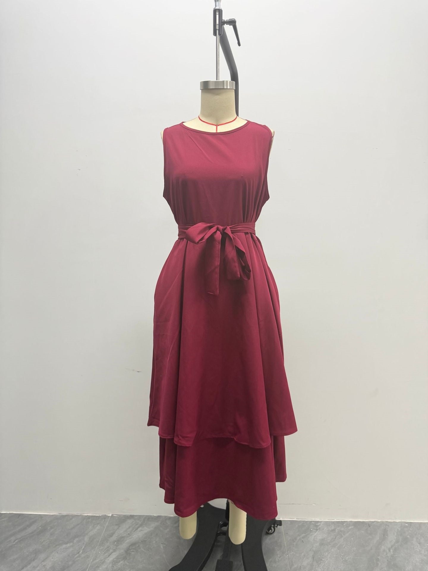 Sleeveless Round Neck Tied Waist Irregular Swing Dress